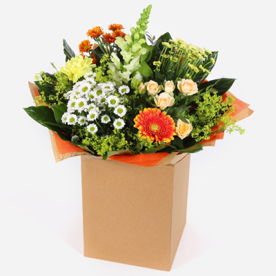 Citrus Sunrise - Capture the essence of a golden meadow with this stunning bouquet of yellow, white, and orange flowers. Presented in a stylish packaging it's perfect for adding natural beauty to any space.
